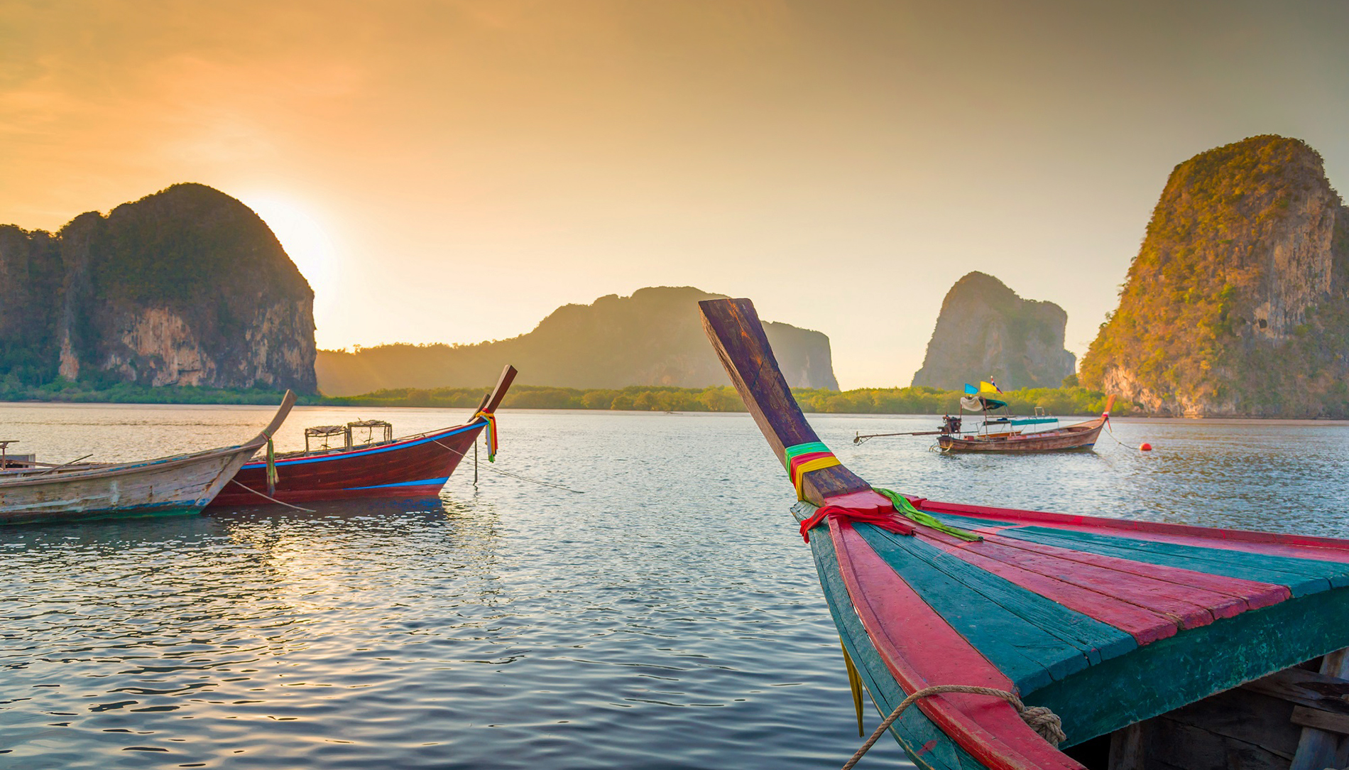 Beach and tropical sea with long-tail boat in thailand | ICS Travel Group